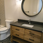 Bathroom constructed with decorative tile by River Ridge Builders.