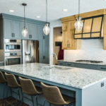 Kitchen island built with granite countertop by River Ridge Builders LLC.